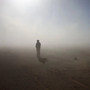 A Sahrawi man stands in the Sahara desert between Tindouf and Tifariti