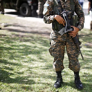 Salvadorean army soldier holds his rifle during a patrol in San Salvador, El Salvador