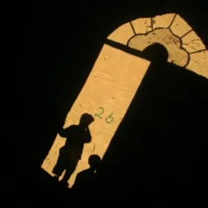 Shadows of Afghan children cast on a wall in the old city of Herat Shadows of Afghan children cast on a wall in the old city of Herat