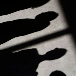 Shadows of people are cast on the carpet of the United Nations Security Council before Shadows of people are cast on the carpet of the United Nations Security Council before