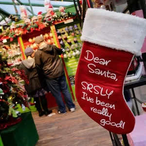 Shoppers buy Christmas stuff in the Manhattan borough of New York City, New York Shoppers buy Christmas stuff in the Manhattan borough of New York City, New York