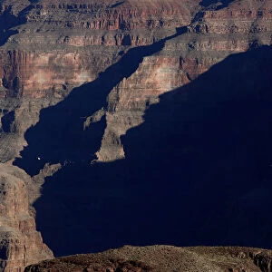 A sightseeing helicopter flying through the west rim of the Grand Canyon is seen