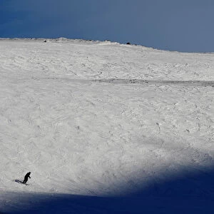 A skier descends the mountain in Glenshee, Scotland