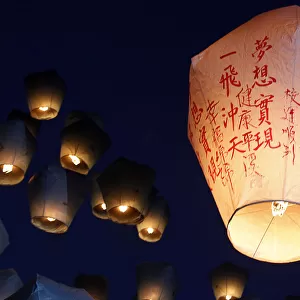 Sky lanterns are released ahead of the traditional Chinese Lantern Festival in Pingxi