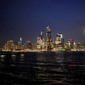 The skyline of New York City is seen as the Worm moon, the last Supermoon sighting of 2019