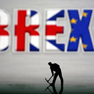 A small toy figure is seen in front of a Brexit logo in this illustration picture