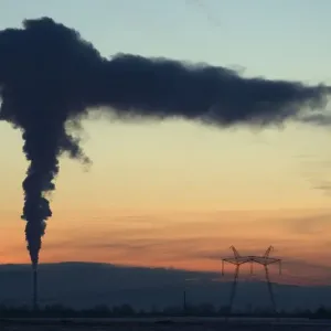 Smoke rises from the chimney stalk of a gas-fired power station during a windless evening Smoke rises from the chimney stalk of a gas-fired power station during a windless evening