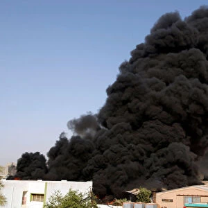 Smoke rises from a storage site in Baghdad, housing ballot boxes from Iraqs May