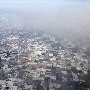 Snow covered farm fields make a quit-like patchwork near Bridgewater, South Dakota