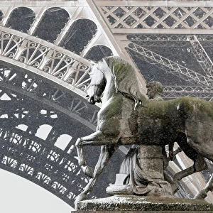 Snow sticks to the statue of a horse next to a roman warrior on the Pont d Iena bridge