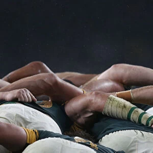 South Africa players compete in a scrum with New Zealand players