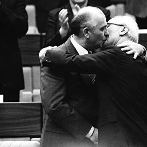 Soviet Leader Mikhail Gorbachev kissing East German Leader Erich Honecker