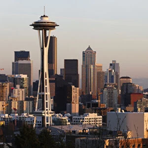 The Space Needle and Mount Rainier are pictured at dusk in Seattle, Washington