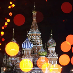 St Basils Cathedral in Moscows Red Square is seen through illuminated New Year