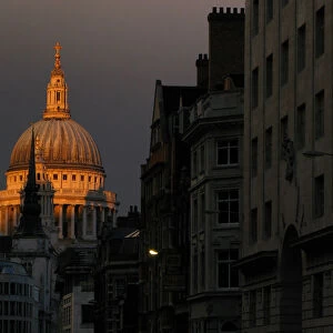 St Pauls Cathedral is seen at dusk beyond Fleet Street in central London