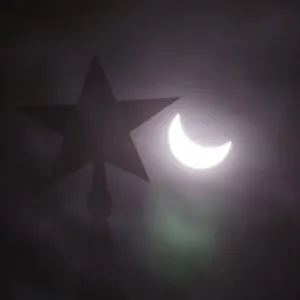 A star on the Kremlin tower during a partial solar eclipse in Moscow, Print