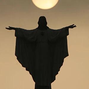 The statue of Jesus Christ at the Resurrection of our Lord parish church is silhouetted