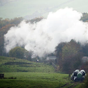 A steam train travels along the East Lancashire Railways line near Irwell Vale station