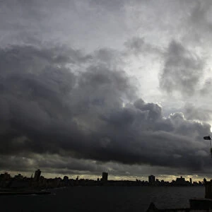 Storm clouds are seen over the skyline of Havana