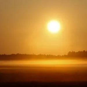 Sun rises over foggy field near the village of Khatenchytsy Sun rises over foggy field near the village of Khatenchytsy