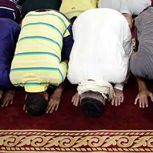 Sunni Muslims perform Eid al-Fitr prayers marking the end of the holy fasting month of