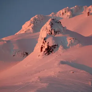 At sunset, climbers and rescue personnel descend Mount Hood At sunset, climbers and rescue personnel descend Mount Hood
