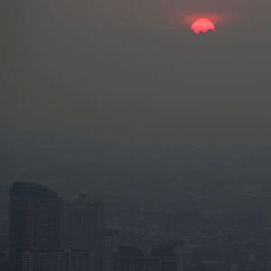 The sunset is seen during a poor air quality day in Bangkok