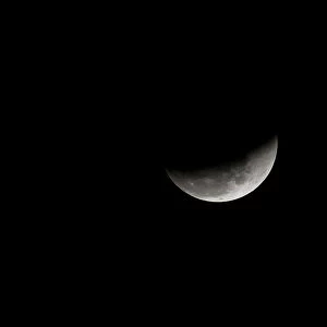 The super blue moon is seen during a lunar eclipse in Karachi