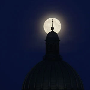 Supermoon is seen behind the St. Isaacs Cathedral in St. Petersburg