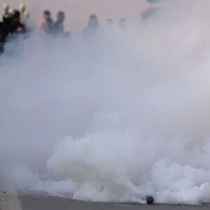 A tear gas shell fired by Indian police explodes during a protest march in Srinagar