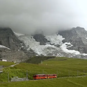 Tourists leave a train of the Jungfraubahn railways at the Kleine Scheidegg station Tourists leave a train of the Jungfraubahn railways at the Kleine Scheidegg station