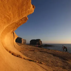 Tourists walk towards Fungus Rock in Dwejra Bay, where five French tourists had departed Tourists walk towards Fungus Rock in Dwejra Bay, where five French tourists had departed