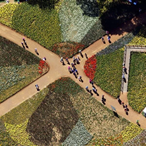Tourists walk on pathways through the Floriade flower festival in Canberra
