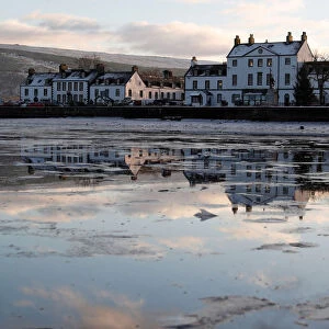The town of Inveraray is reflected in Loch Fyne, Scotland