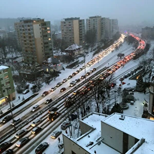 Traffic is stalled during a snowfall in Gdynia