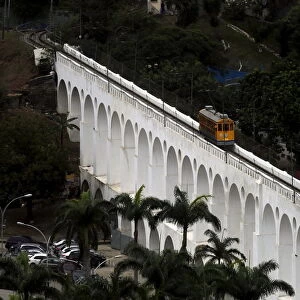 Tram is seen on a line over the Lapa Arches, an old aqueduct from the colonial era