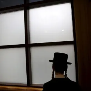 An ultra-Orthodox Jewish man attends the funeral of Rabbi Yochanan Sofer