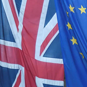 A Union flag flies next to the flag of the European Union in Westminster, London