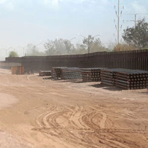 View of the 30-foot high bollard style wall at US-Mexico border to replace a section near
