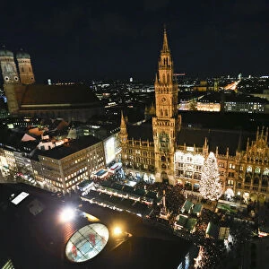 A view of Munichs illuminated townhall during the Christmas market after the official