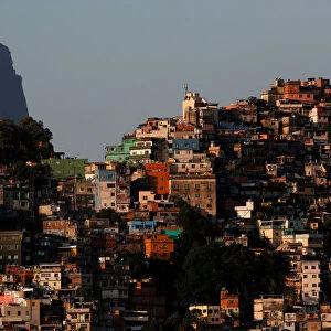 A view of the Rocinha slum with the Christ the Redeemer statue in the background