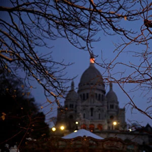 A view shows the Sacre Coeur basilica at the Butte Montmartre in the early morning in
