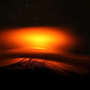The Villarrica Volcano is seen partially covered by clouds at Pucon
