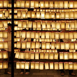Visitors look at paper lanterns during Mitama Festival at Yasukuni Shrine in Tokyo