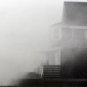 A wave crashes onto a house before the arrival of Hurricane Sandy in Scituate A wave crashes onto a house before the arrival of Hurricane Sandy in Scituate
