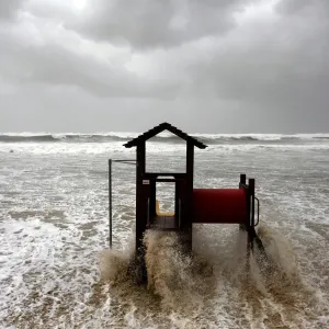 Waves break on a slide on the shore of the Mediterranean in Tel Aviv