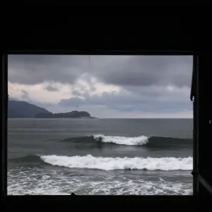 Waves in the sea are seen through a window of a building destroyed by March 11s magnitude 9