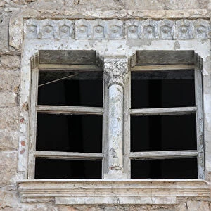 Window of a historic building, that was damaged during a three-year conflict