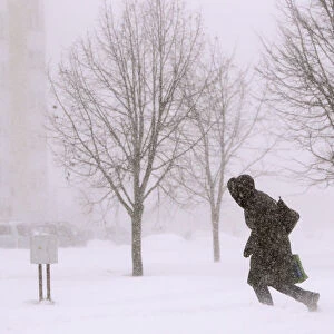 Woman walks during a heavy snow storm in central Minsk