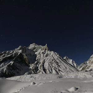 The worlds second largest mountain, the 8, 611 meter high K2 is illuminated by the moon